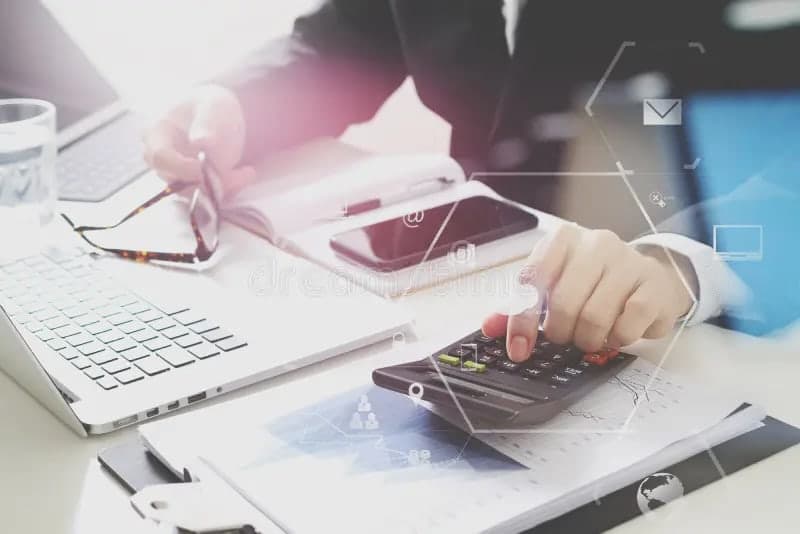 Student using a laptop to solve statistics homework with charts, formulas, and calculator tools on screen